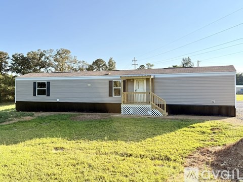A mobile home with a porch and a covered entrance.