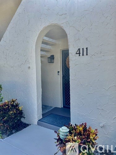 A white building with the number 411 on it.