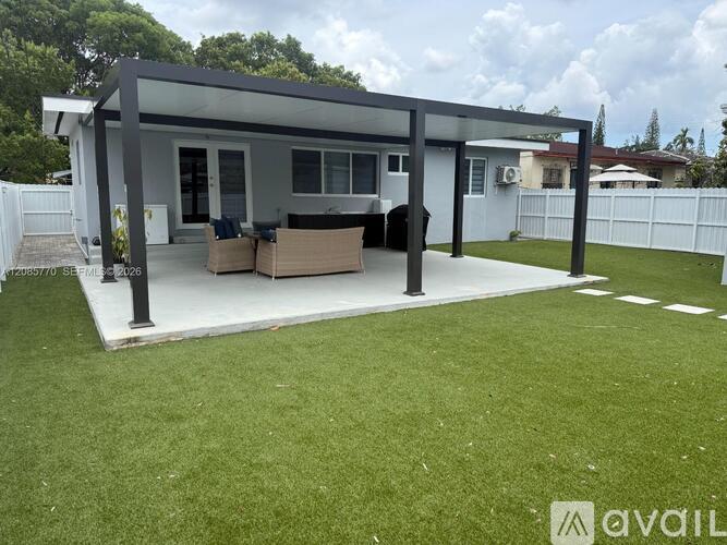 A modern house with a covered patio area.