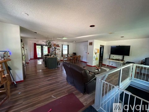 A living room with a couch and a television.