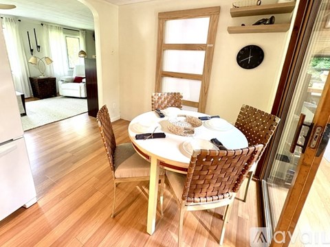 A dining room with a table set for two.
