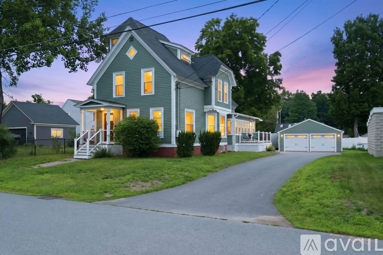 A house with a driveway leading to the garage.