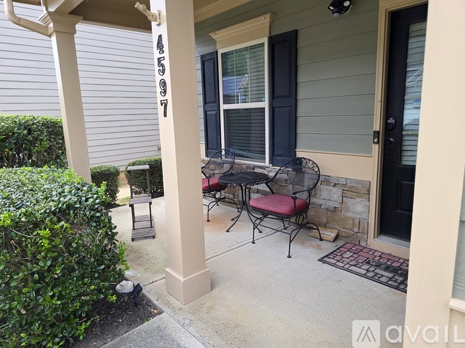 A patio with a table and chairs is numbered 4597.