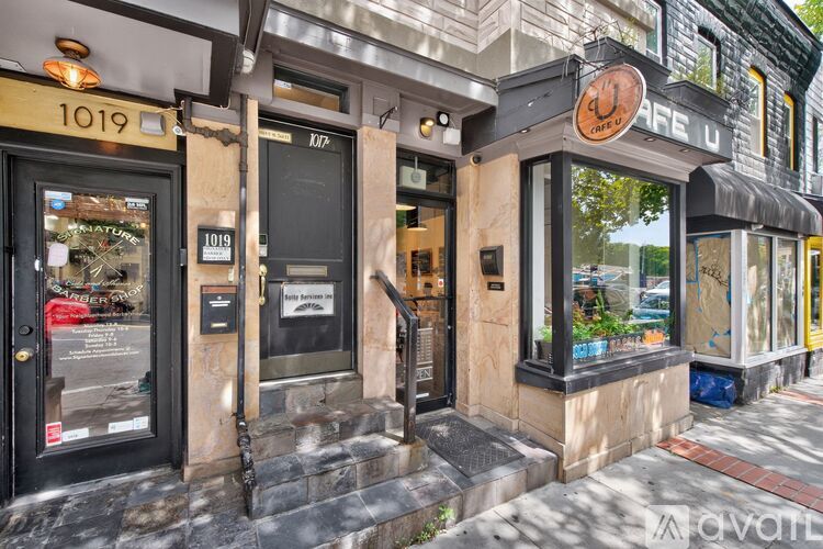 The image shows a storefront with the number 1019 on it.