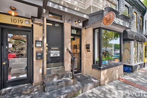 The image shows a storefront with the number 1019 on it.