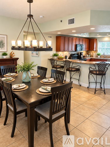 A dining room with a table set for six.