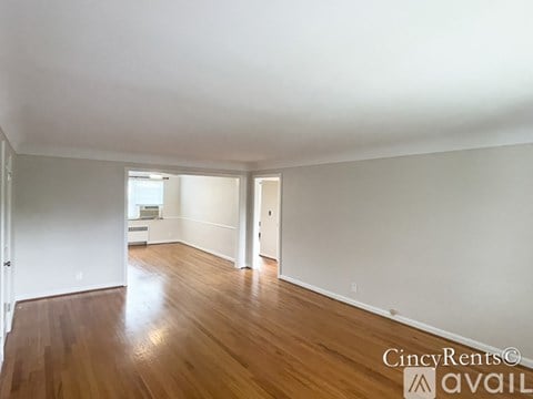 A room with wooden floors and white walls.