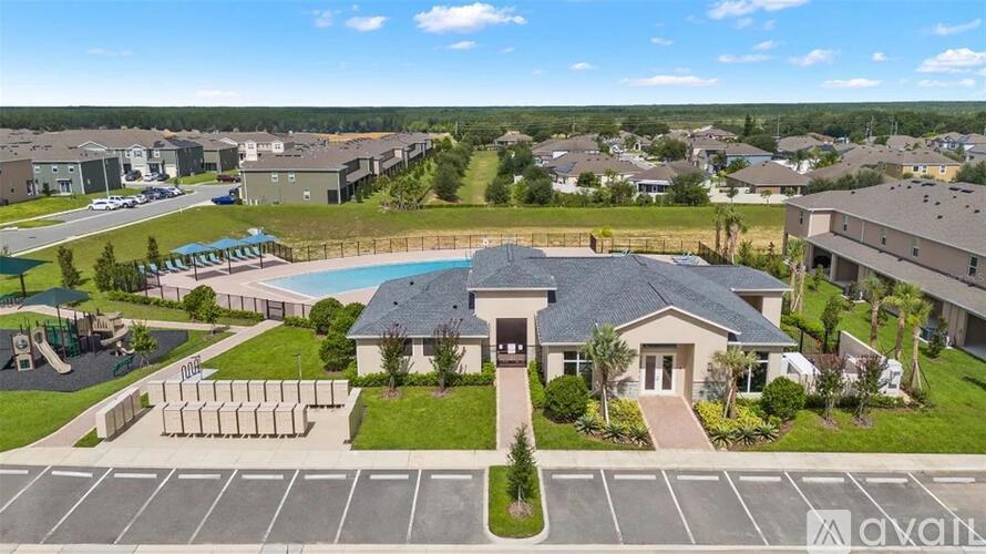 A residential area with a swimming pool and a house with a sign that says "Avalon".