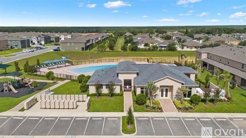 A residential area with a swimming pool and a house with a sign that says "Avalon".
