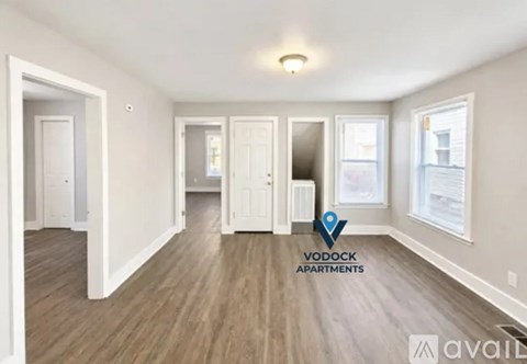 A spacious, empty apartment is available for rent.