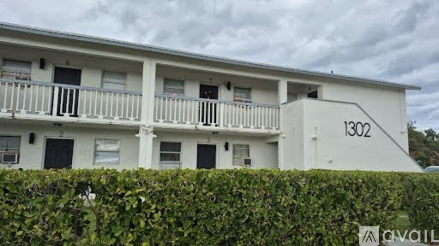 A white building with the number 1302 on it.
