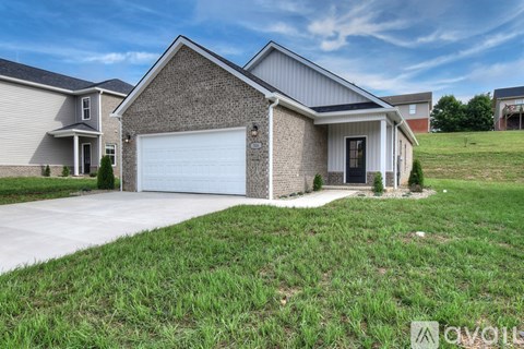 A house with a garage is available for sale.