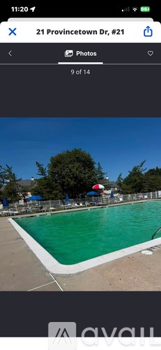 A swimming pool with a blue sky in the background.