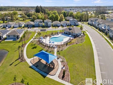 A residential area with houses and a swimming pool.