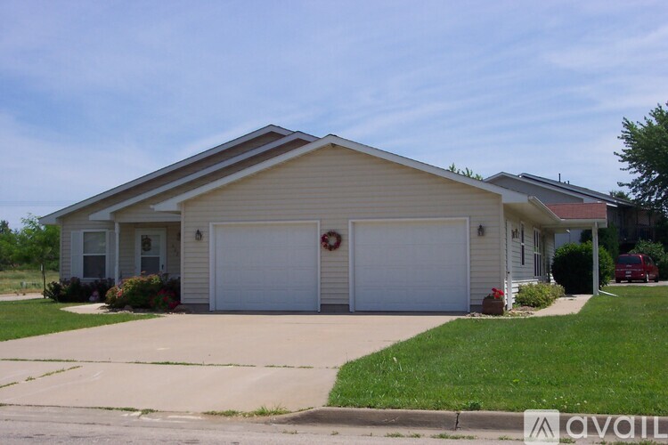 A two-car garage with a wreath on the door.