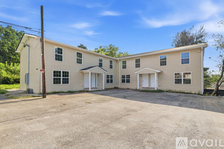 A two-story house with a garage is available for rent.