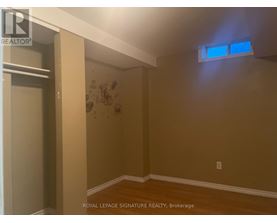 A room with a brown wall and a white ceiling.