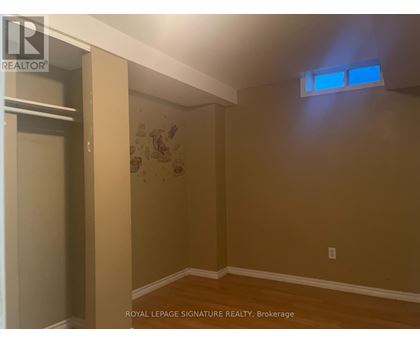 A room with a brown wall and a white ceiling.