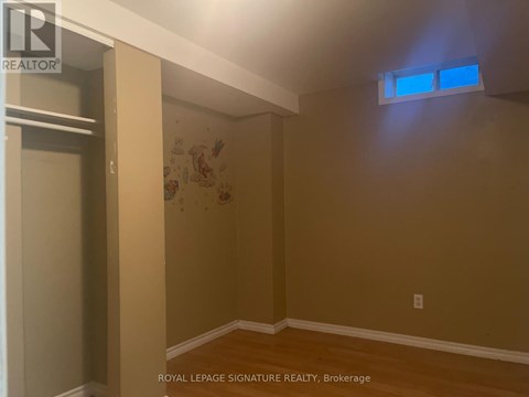 A room with a brown wall and a white ceiling.