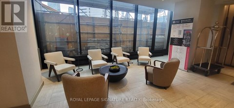 A room with a table and chairs in it.