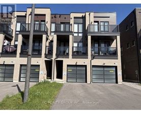 A building with multiple balconies and garage doors is shown.