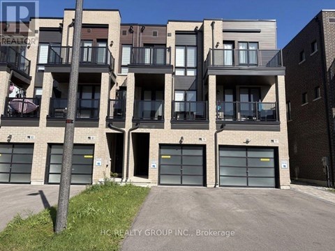 A building with multiple balconies and garage doors is shown.