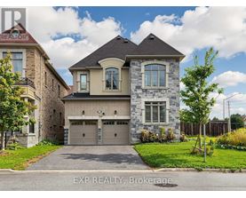 A house with a grey garage door is for sale.