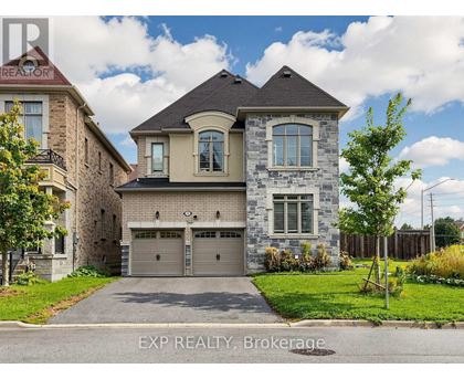 A house with a grey garage door is for sale.
