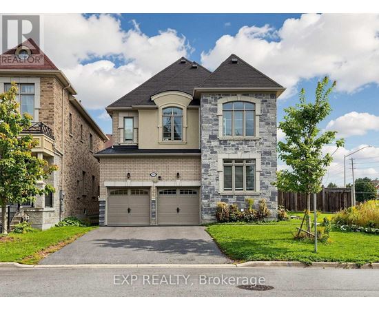 A house with a grey garage door is for sale.