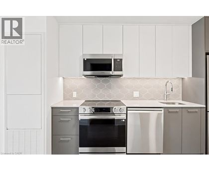 A kitchen with a stove top oven and microwave above it.