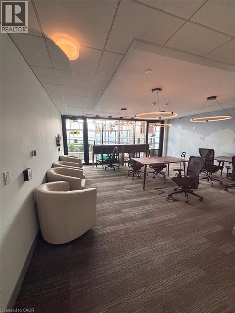 A conference room with a long table and chairs.