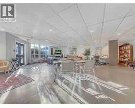 A spacious office with a reception desk and multiple chairs.