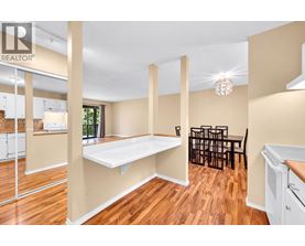 A realtor image of a kitchen and dining area.