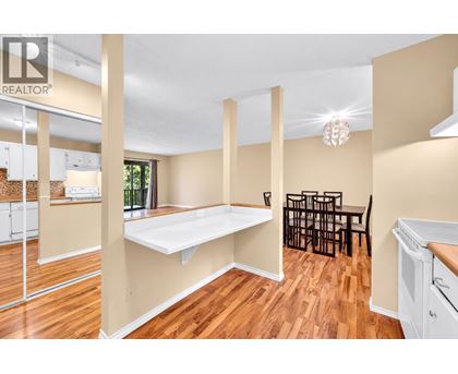 A realtor image of a kitchen and dining area.