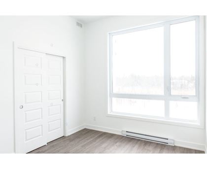 A white door with a window above it.