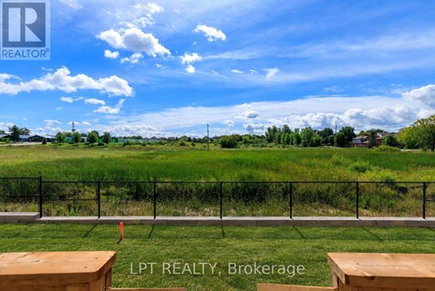 A fence with a sign that says LPT REALTY Brokerage.