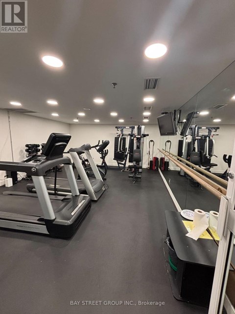 A gym with treadmills and exercise equipment.