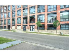 A red brick building with the word REALTOR on the side.