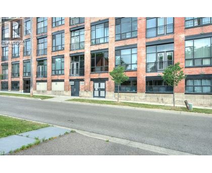 A red brick building with the word REALTOR on the side.