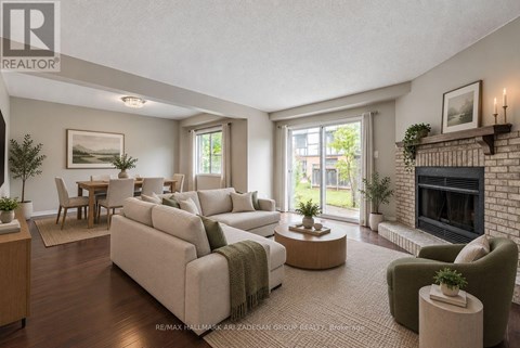 A living room with a fireplace and a couch.
