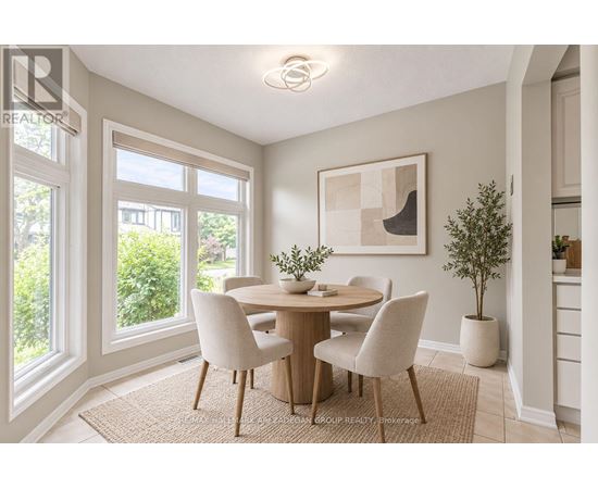 A dining room with a table set for four.