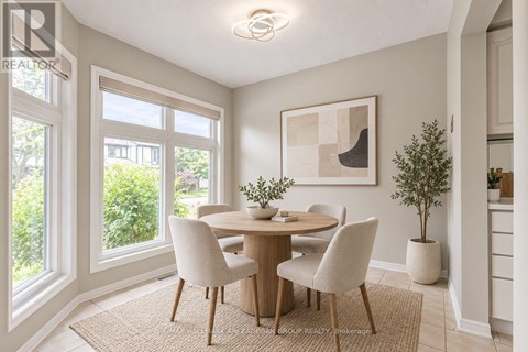 A dining room with a table set for four.