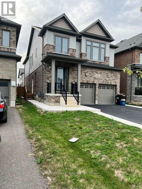 A house with a grey garage door is in front of a house with a brown garage door.