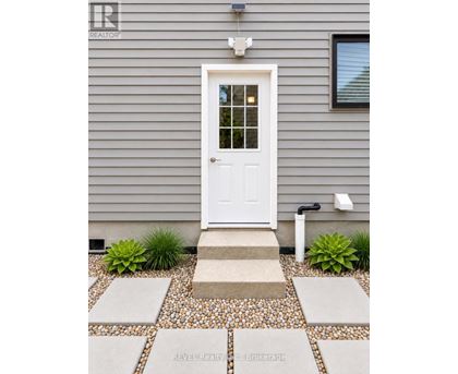 A white door is on the front of a house.