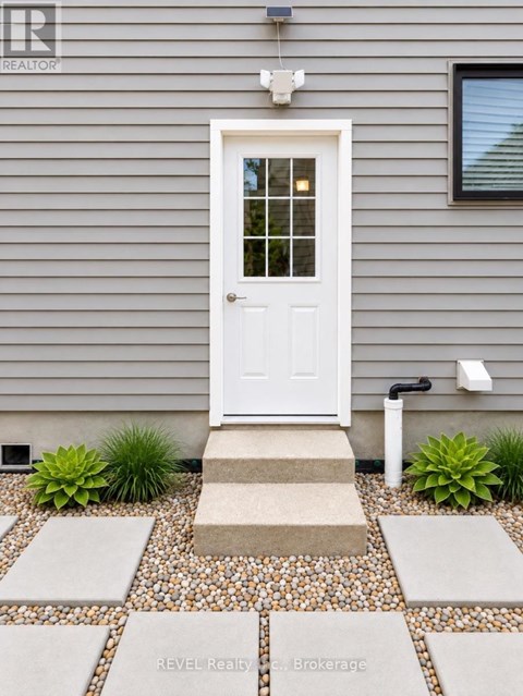 A white door is on the front of a house.