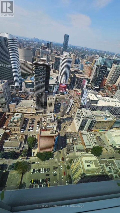 A cityscape with a mix of residential and commercial buildings.