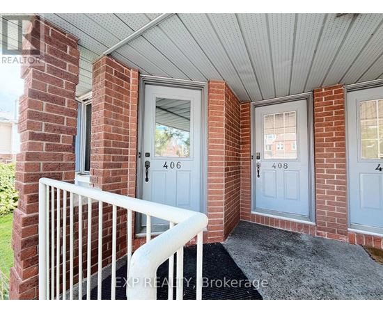 A house entrance with a white railing and a grey door.