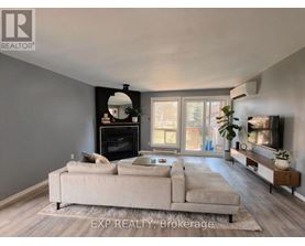 A living room with a fireplace and a couch.