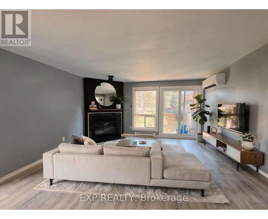 A living room with a fireplace and a couch.