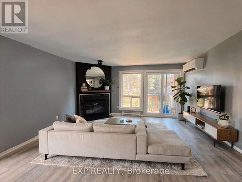 A living room with a fireplace and a couch.